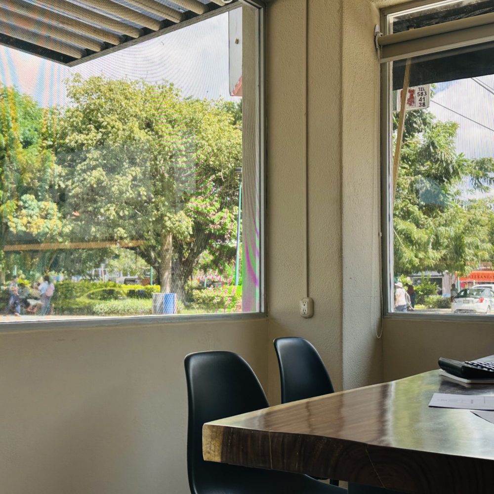 Real estate consulting desk with a street view inside the Salmo 23 Huatulco office.